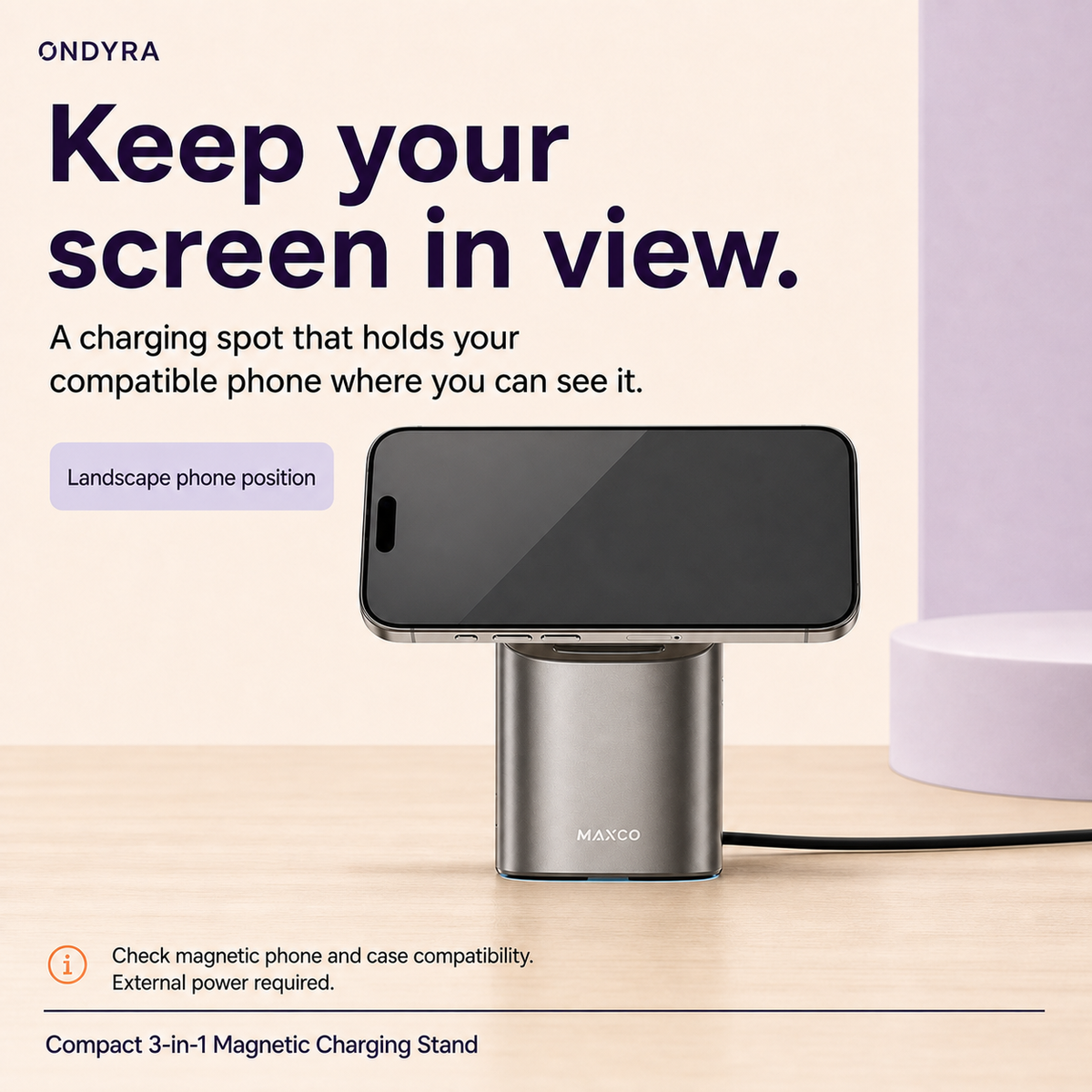 Compact silver magnetic charging stand supporting a compatible phone in landscape orientation, with the screen facing forward.