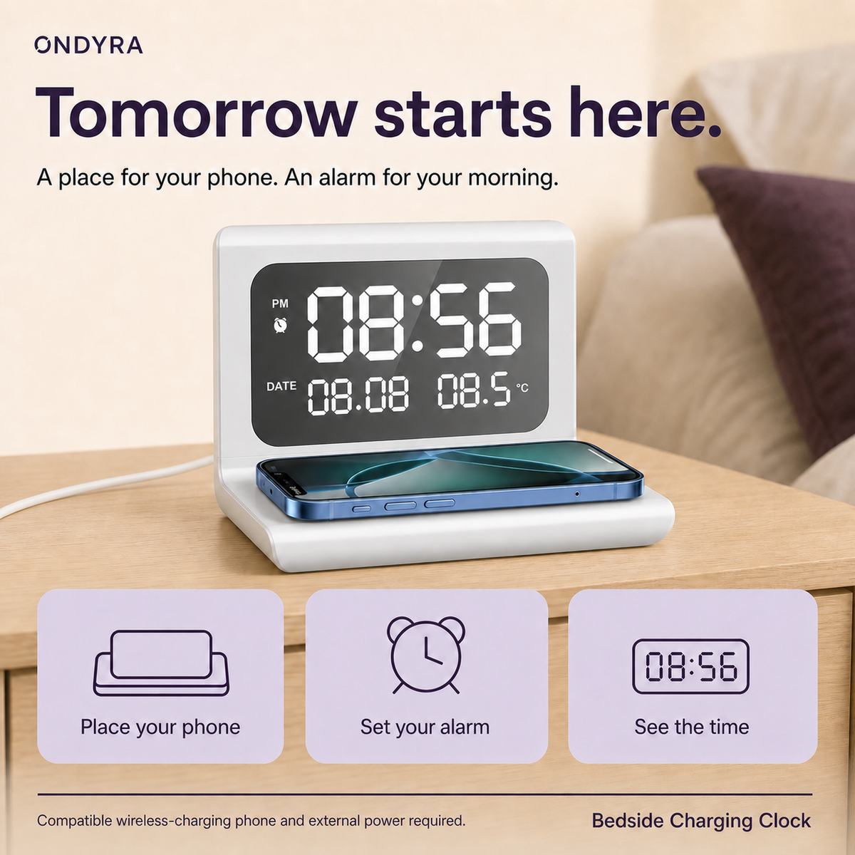 Silver-white bedside charging clock with a phone on its base, alongside prompts to place the phone, set an alarm and check the time.